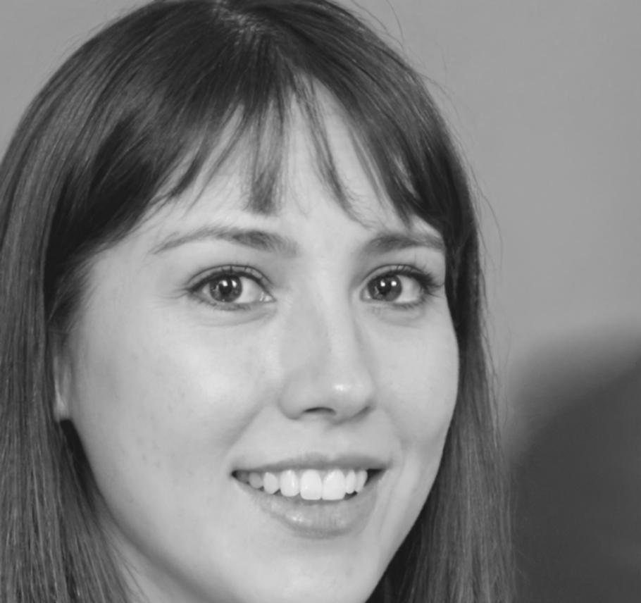 Professional portrait of financial analyst reviewing reports