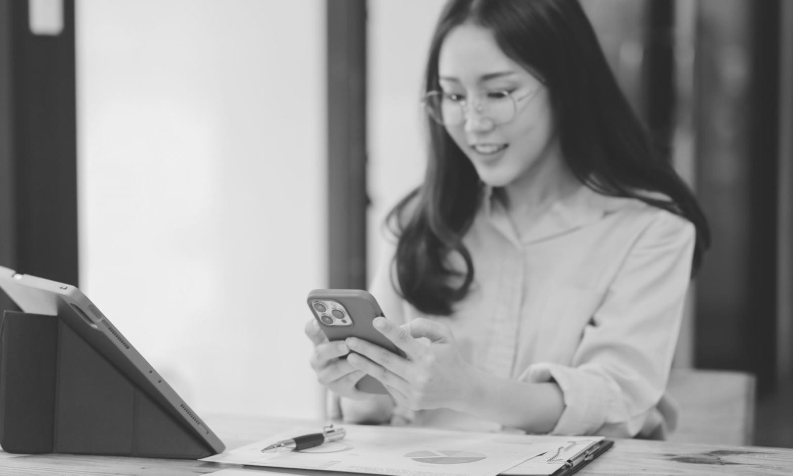 Students working on financial analysis projects with laptops and data visualizations